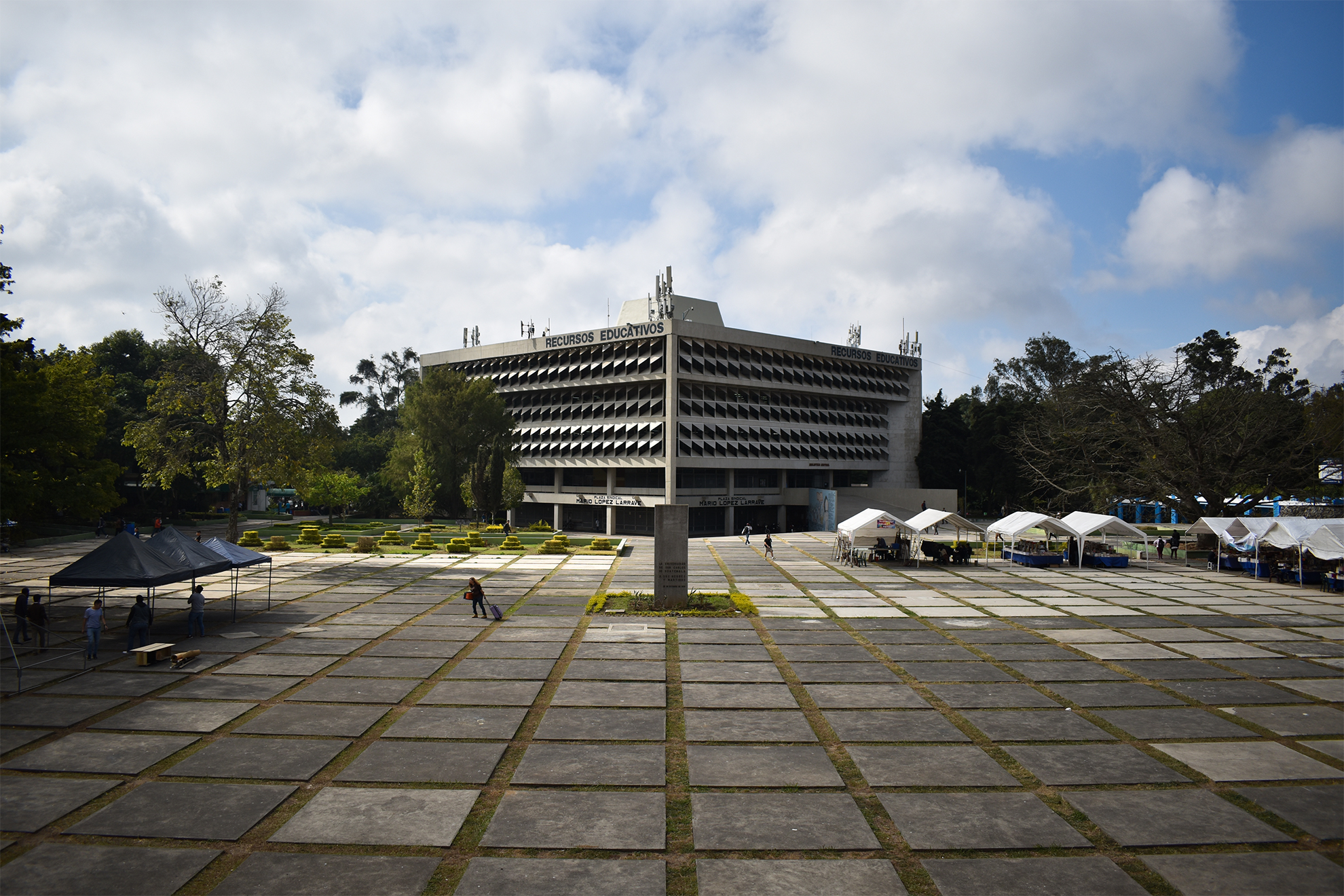 Aerial city skyline emerging through fog during blue hour